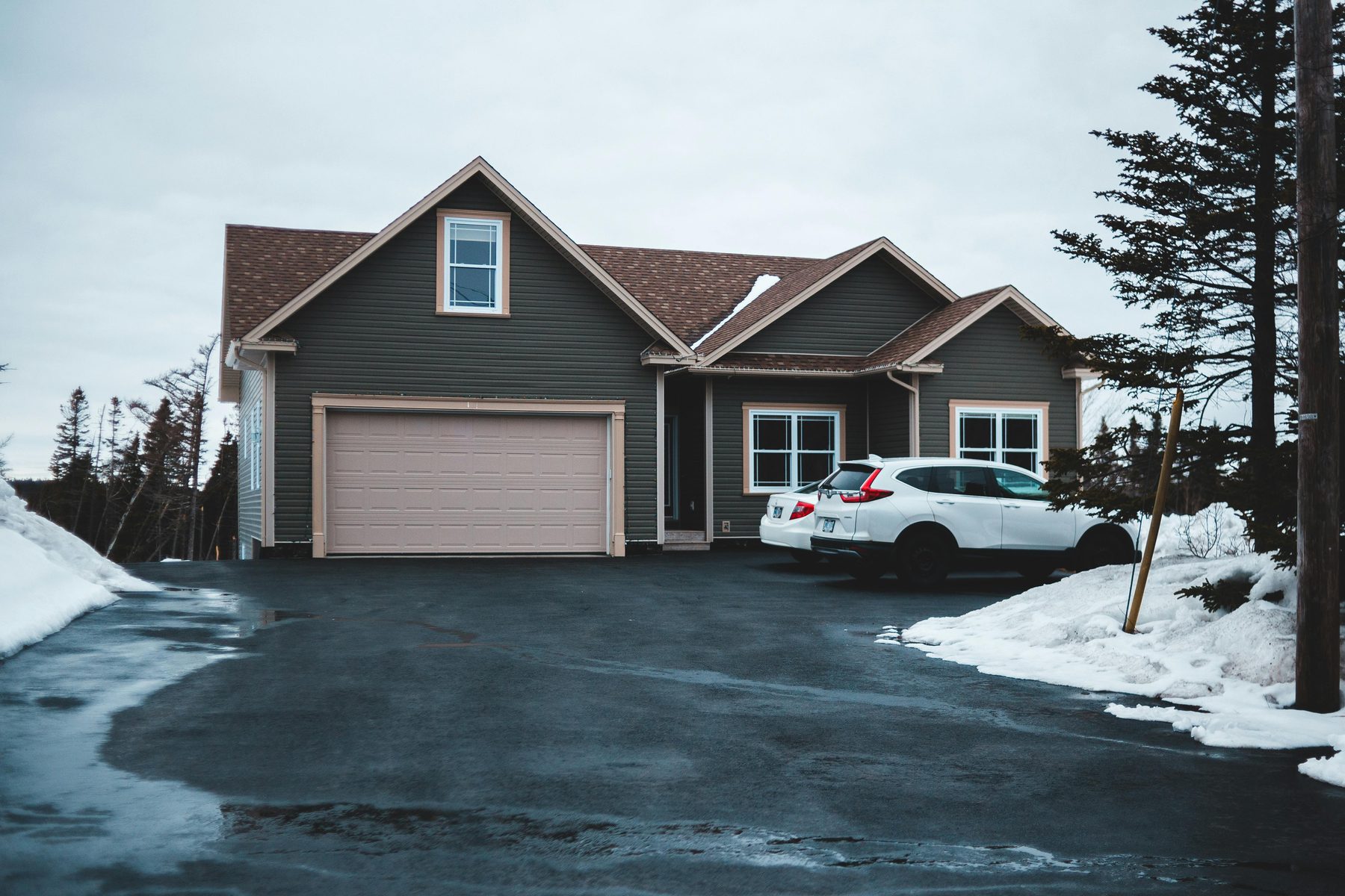 A quiet house on a winter lot.