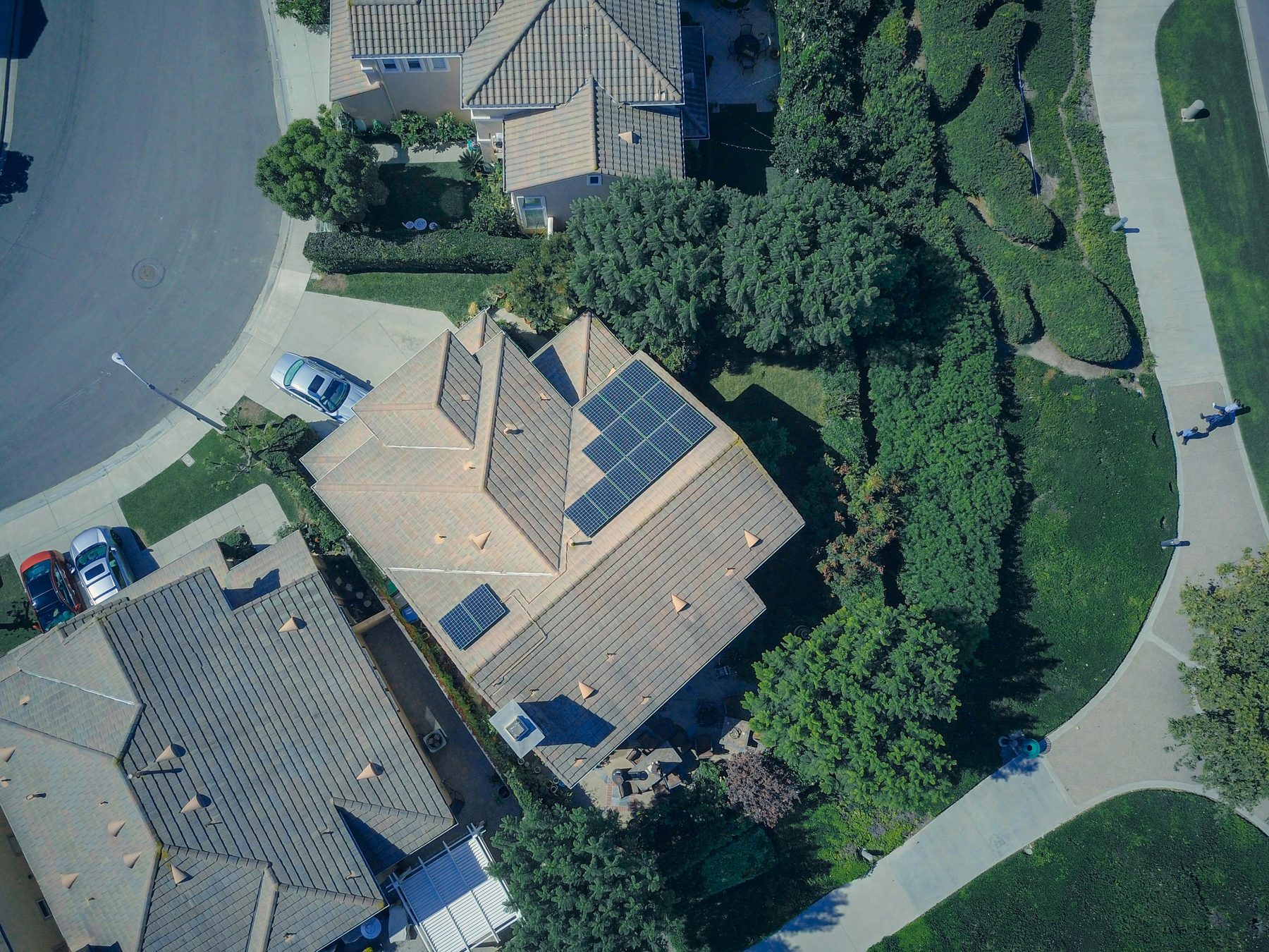 A close aerial of a house and its lot.