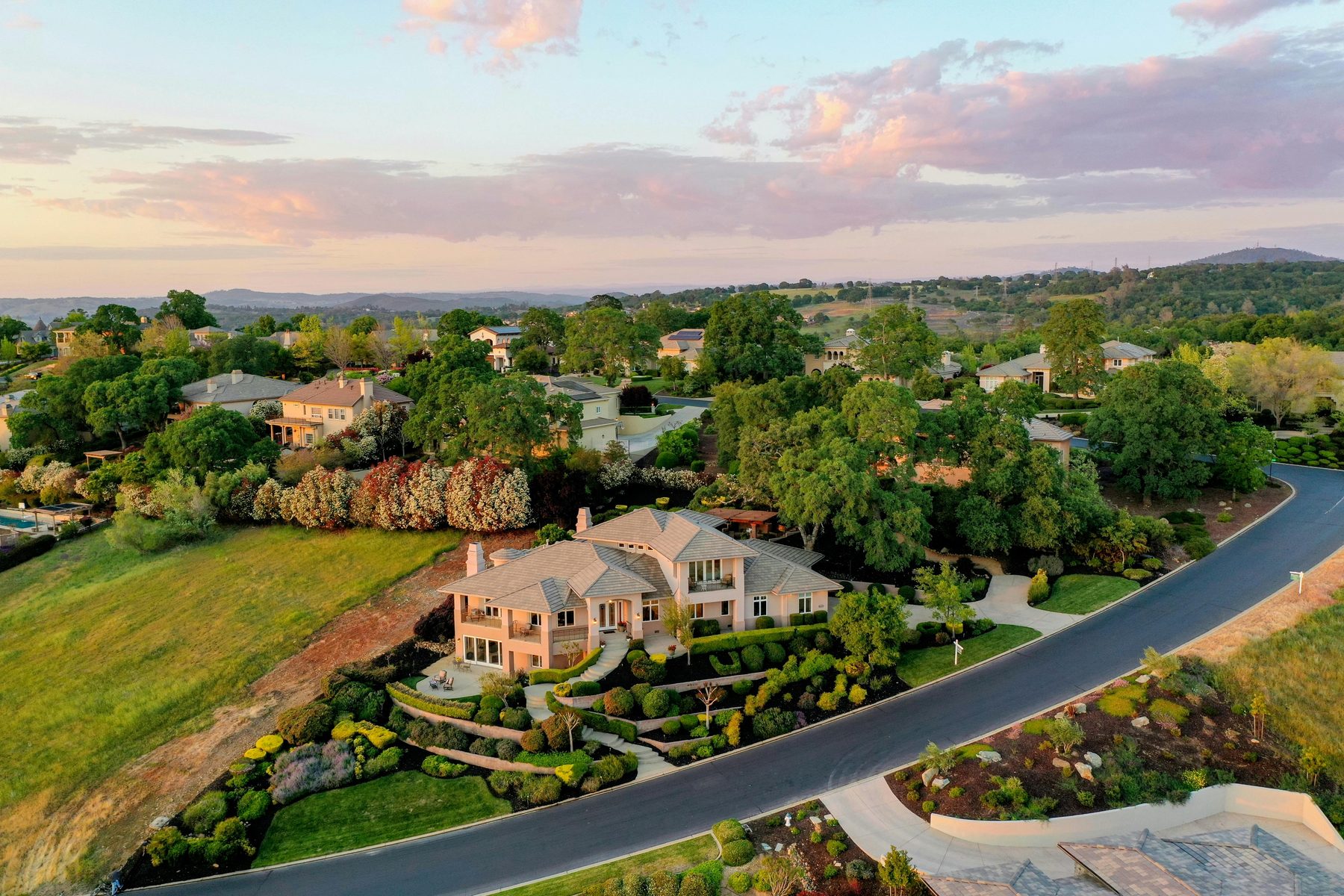 A luxury lot at dusk, seen from above.