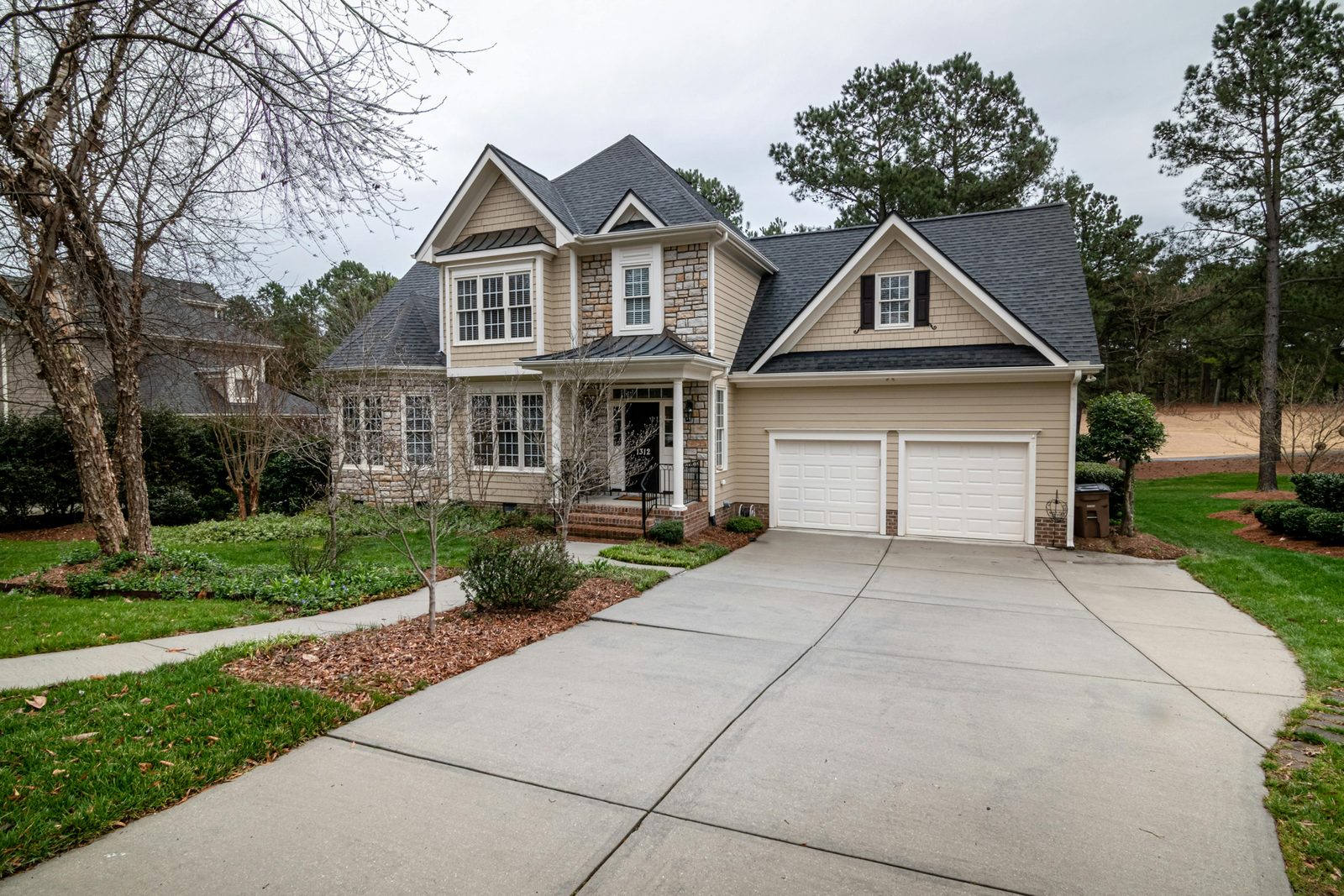 Quiet residential lots along a tree-lined street ready for new builds.